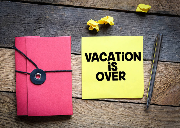 Vacation is over note on wooden table - Photo, Image