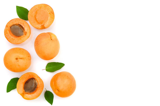 Apricot fruits with leaves isolated on white background with copy space for your text. Top view. Flat lay pattern - Photo, Image