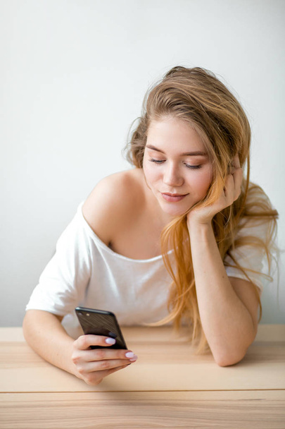 a hipster girl typing a message while resting - Photo, Image