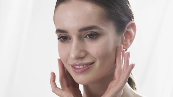 Face Skin Care. Beautiful Woman Touching Face Skin And Smiling - Záběry, video