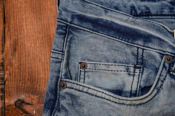 синя джинсова текстура на фоні дерева
 - Фото, зображення