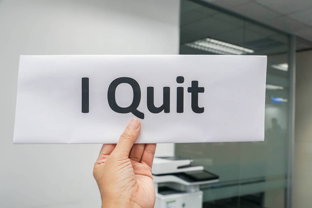 close up people hold paper sheet of I quit for resignation from office - Photo, Image