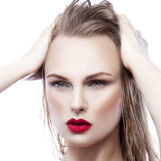 portrait of young woman with natural makeup and red lips on white background - Photo, Image