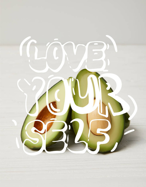 fresh green avocado, clean eating concept. "Love your self" inspiration - Фото, изображение