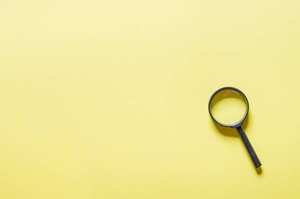 Loupe or magnifier on yellow background.  - Photo, Image