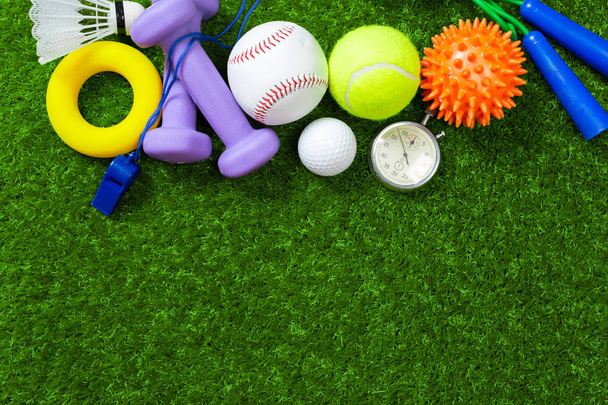 Various sport tools on grass, close-up view - Φωτογραφία, εικόνα