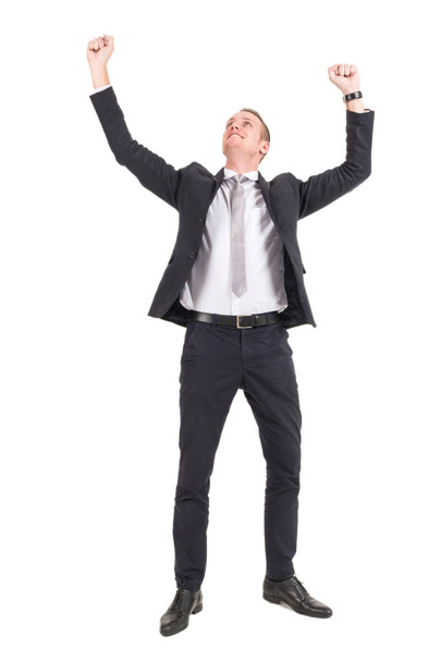 Successful businessman celebrating with arms up - Foto, Bild