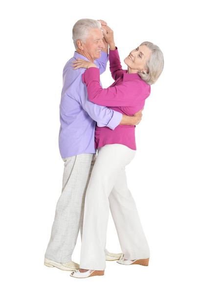 portrait of happy senior couple dancing  isolated on white background - Photo, image