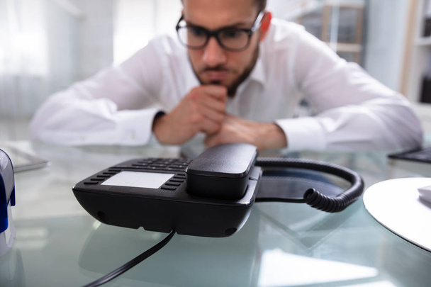 Young Businessman Waiting For A Call On Landline - Photo, Image