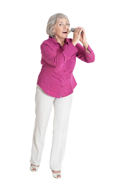 senior woman singing  isolated on white background - Foto, afbeelding