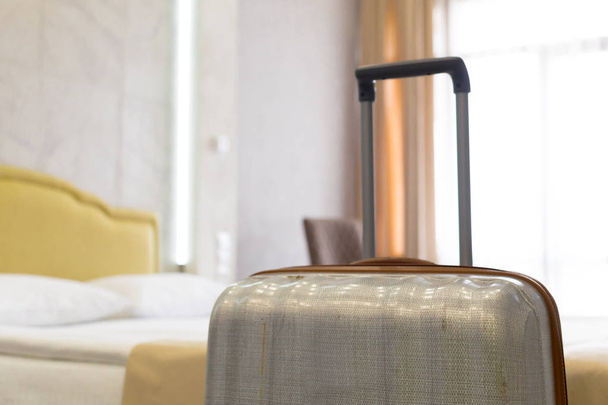 Suitcase or luggage bag in a modern hotel room - Foto, afbeelding