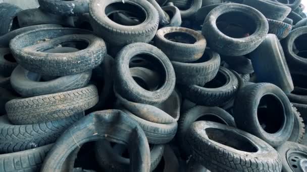 Lots of used tires, close up. Car tires are thrown away to the dump. - 映像、動画