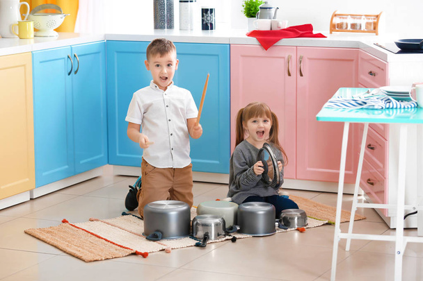 children playing with kitchenware as musical band - Foto, Imagen