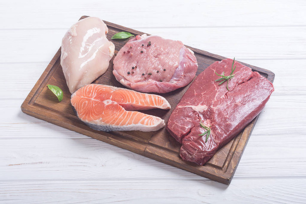 Mix of steak meat : salmon , beef , pork and chicken - Photo, image