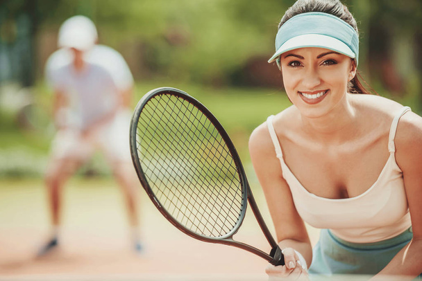Portrait of Beautiful Young Girl on Tennis Court. - Фото, изображение