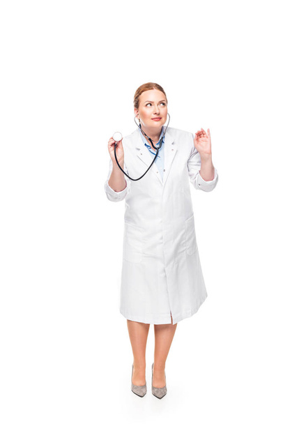 beautiful female doctor in white coat with stethoscope isolated on white background - Valokuva, kuva