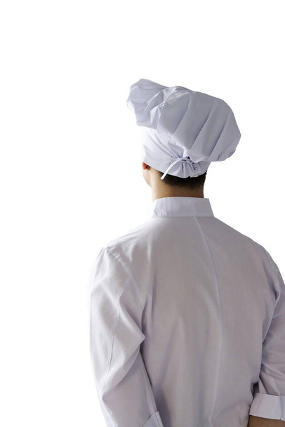Vista traseira do chef isolado no fundo branco. A forma branca do cozinheiro fica para trás
. - Foto, Imagem