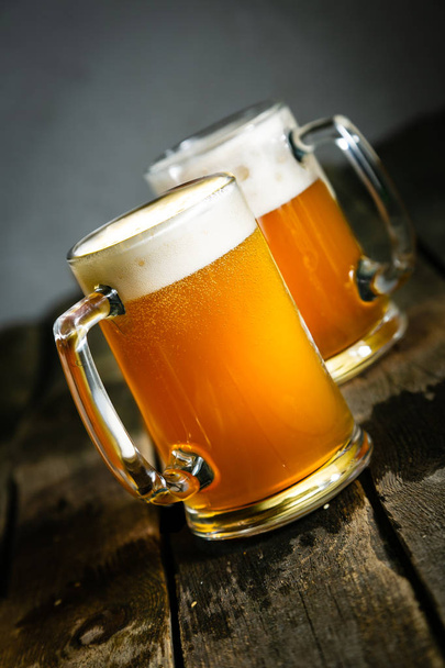 Beer in glasses on rustic background - Valokuva, kuva
