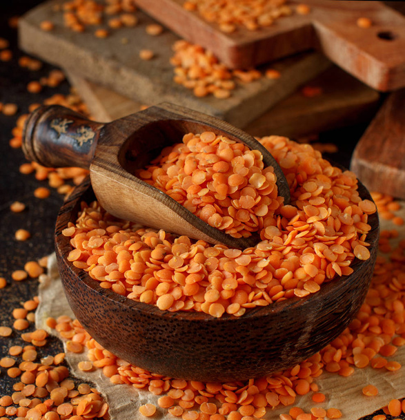 Red lentils in a bowl with a spoon close up - Photo, Image