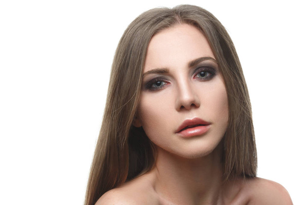 Beauty portrait of chic woman with long straight hair isolated on white background. - 写真・画像