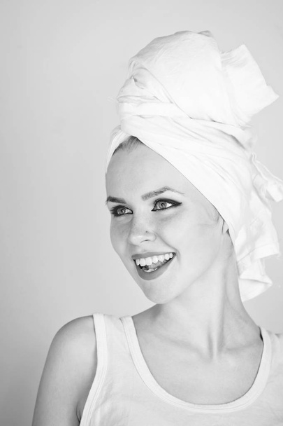woman smiling with white bath towel on head - Foto, Imagem