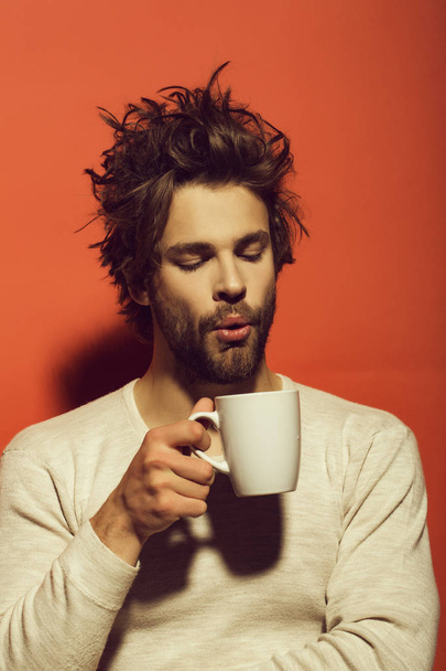 tea or coffee at man blow in cup - Foto, Bild