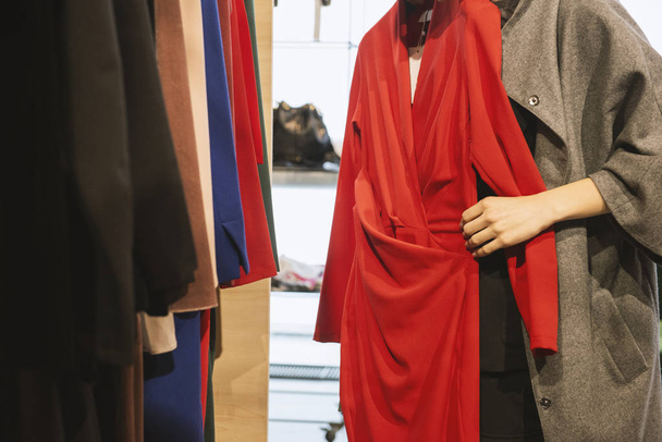 Girl in a clothing store - shopping concept - 写真・画像