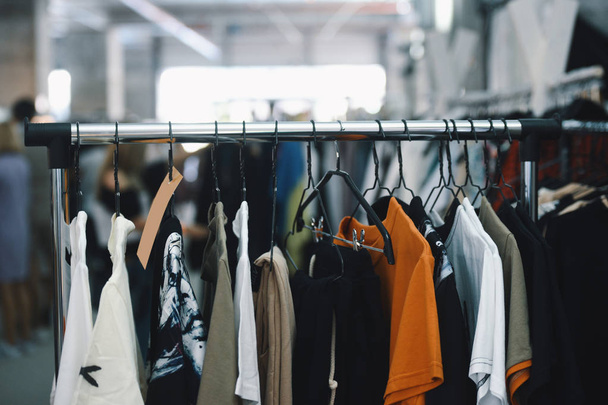Women clothing on hangers in a boutique store - Fotoğraf, Görsel