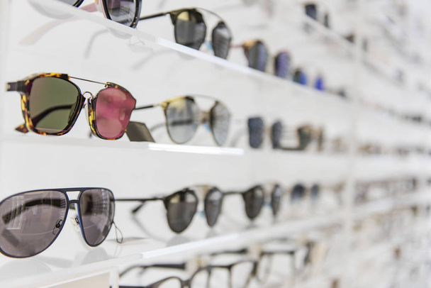 Elegant sunglasses in a store - Foto, Imagen
