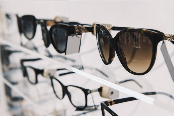 Elegant sunglasses in a store - Foto, imagen
