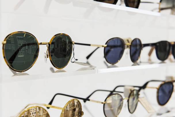 Elegant sunglasses in a store - Фото, зображення