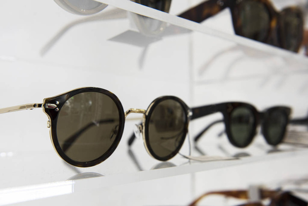 Elegant sunglasses in a store - Foto, Imagen