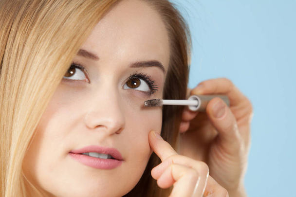Visage concept. Close up woman getting make up on eyelids. Applying mascara with brush by professional artist - Φωτογραφία, εικόνα