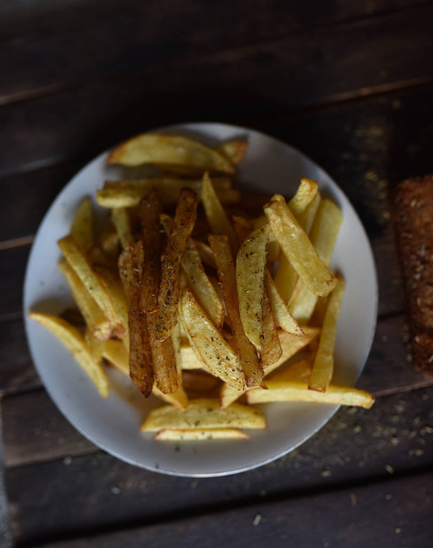 French fries on a white plate - Foto, Bild