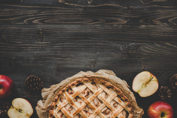 Traditional homemade apple pie on the wooden table with copy space. Top view - Photo, image