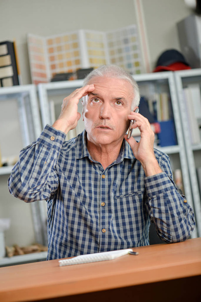 Stressed man on the phone - Photo, image
