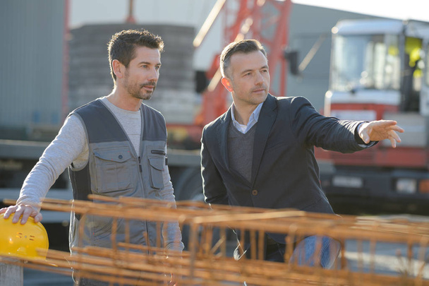 men having a conversation on the construction site - Valokuva, kuva