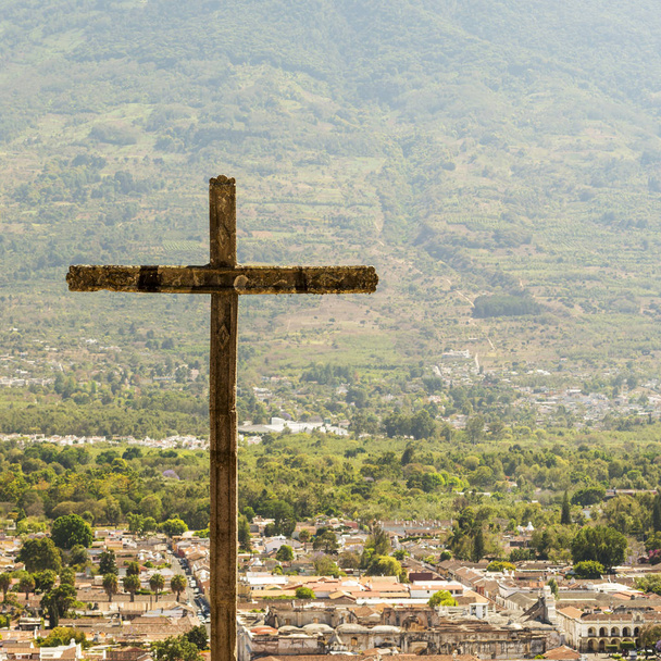 Cerro de la Cruz lookout above the tourist town of Antigua, Guatemala with volcano behind - Photo, Image