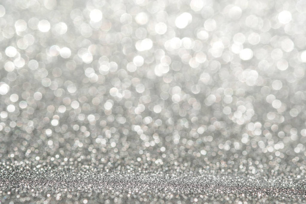 Abstract light silver sparkling glitter wall and floor perspective background studio with blur bokeh.luxury holiday backdrop mock up for display of product.holiday festive greeting card - Photo, image