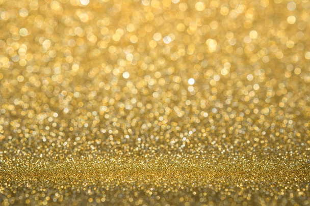 Abstract gold sparkling glitter wall and floor perspective background studio with blur bokeh.luxury holiday backdrop mock up for display of product.holiday festive greeting card - Photo, Image