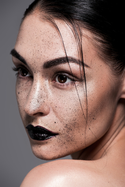attractive model with black lips and freckles, isolated on grey - Foto, Bild