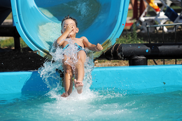 Little boy playing in a water park - Photo, Image
