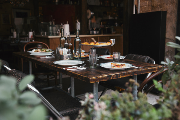 delicious italian meal on rustic table at modern restaurant - Valokuva, kuva