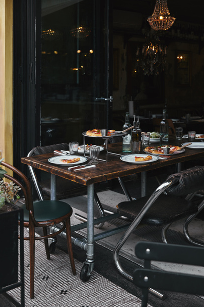 tasty meal on rustic table at modern restaurant - Foto, imagen
