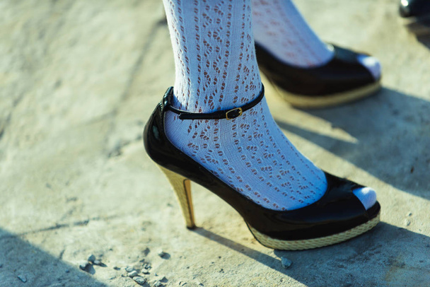 Shoe concept. High heel shoes on female feet. Shoe fashion. Shoes designed to move on - Foto, Bild