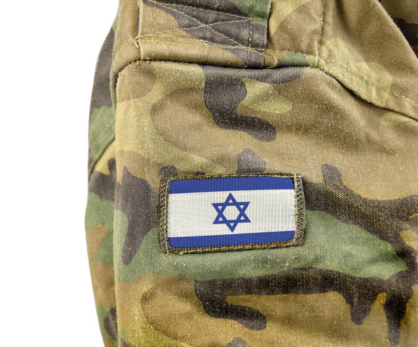 Cropped closeup shot of a Israel flag on a soldier's uniform with white background - Photo, image