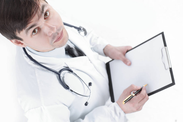 closeup of a doctor holding in his hands a map of the patient. - Foto, imagen