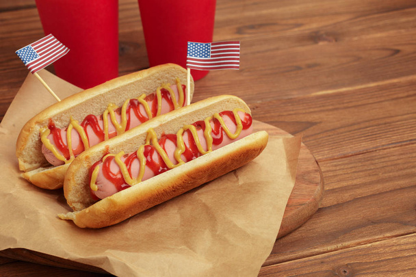 Hot dogs on wooden background - Фото, зображення