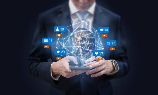 Businessman using mobile smart phone, and augmented reality with social media, network notification icons. Element of this image are furnished by NASA - Photo, Image
