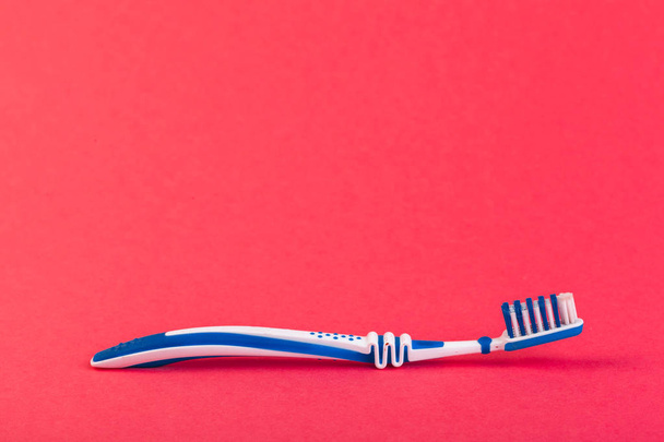 close-up view of toothbrush on light background  - Foto, afbeelding